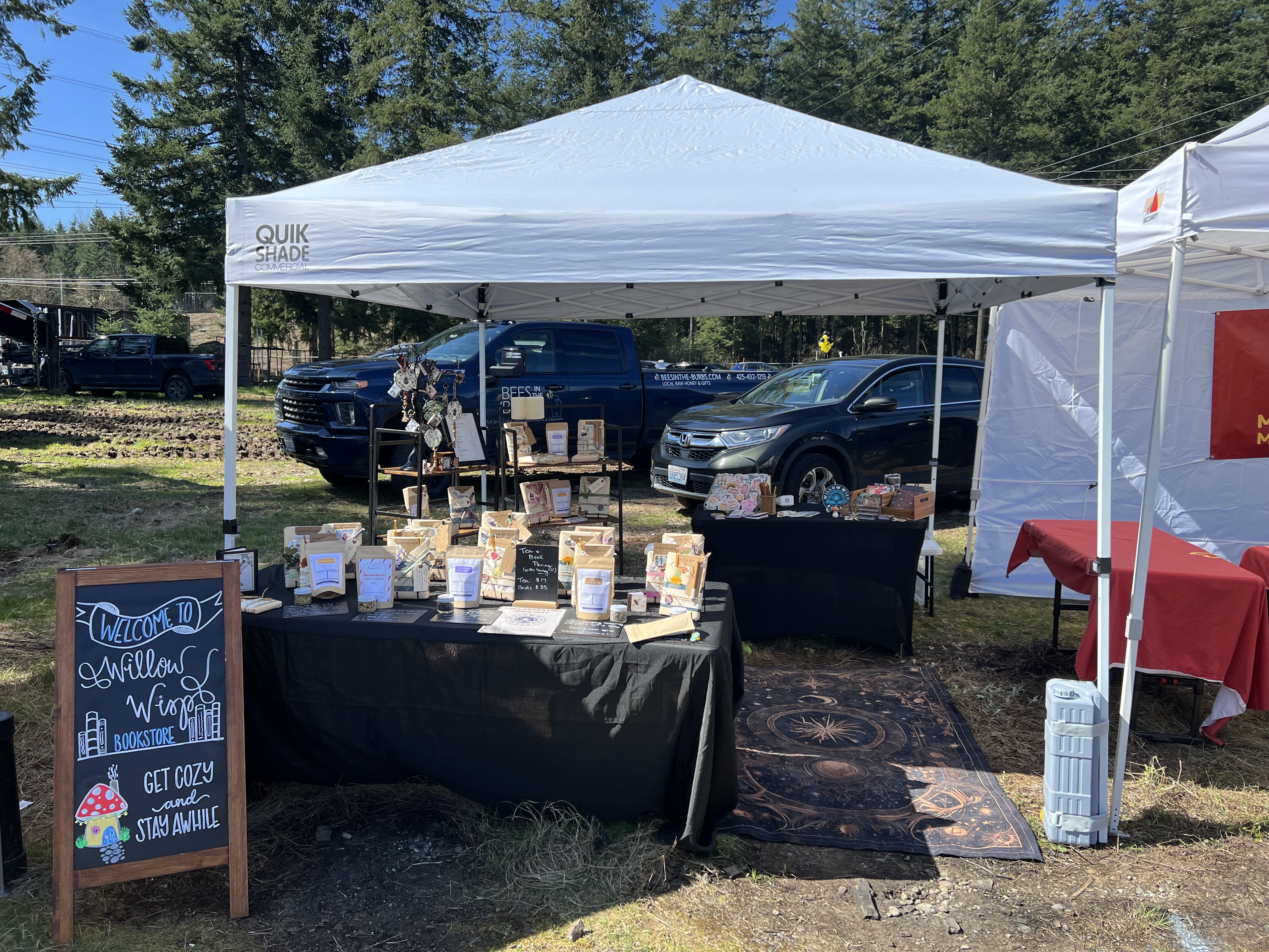 Willow Wisp Books tent setup at Bees in the Burbs
