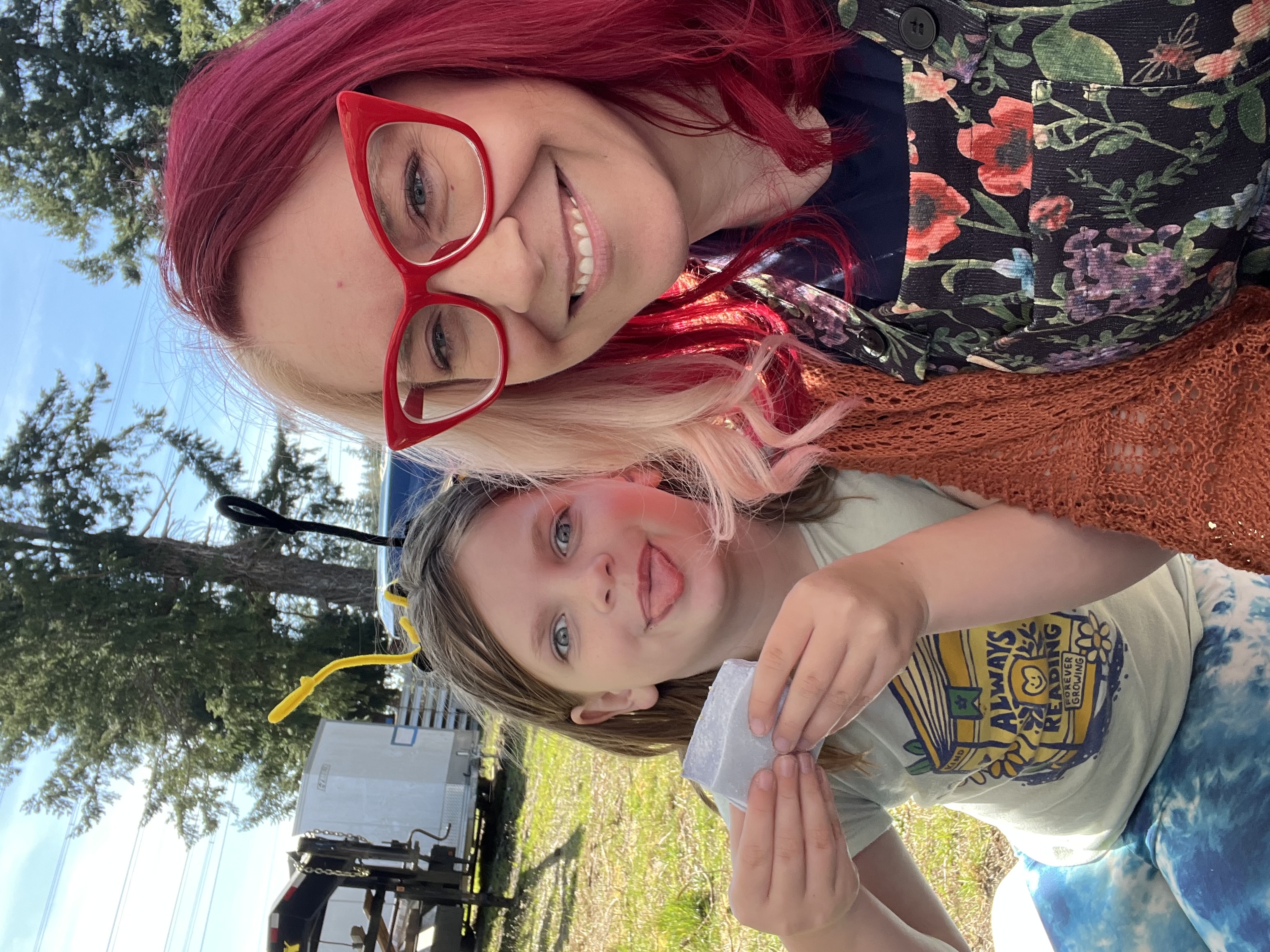 Kayla and a young visitor at the event