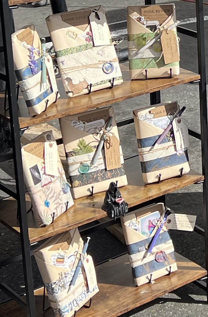 Beautifully hand-wrapped Blind Date with a Book packages with wax seals, pressed flowers, and vintage tags